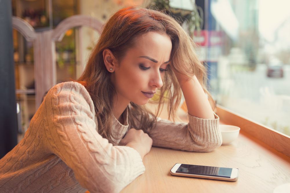 woman looking at phone